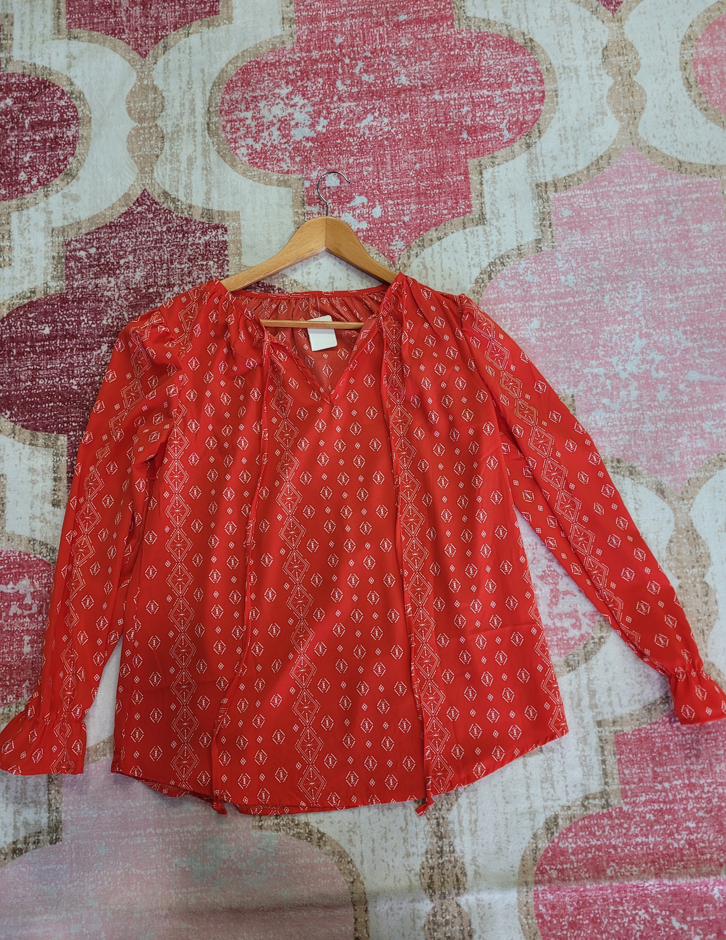Red all over print tye neck blouse